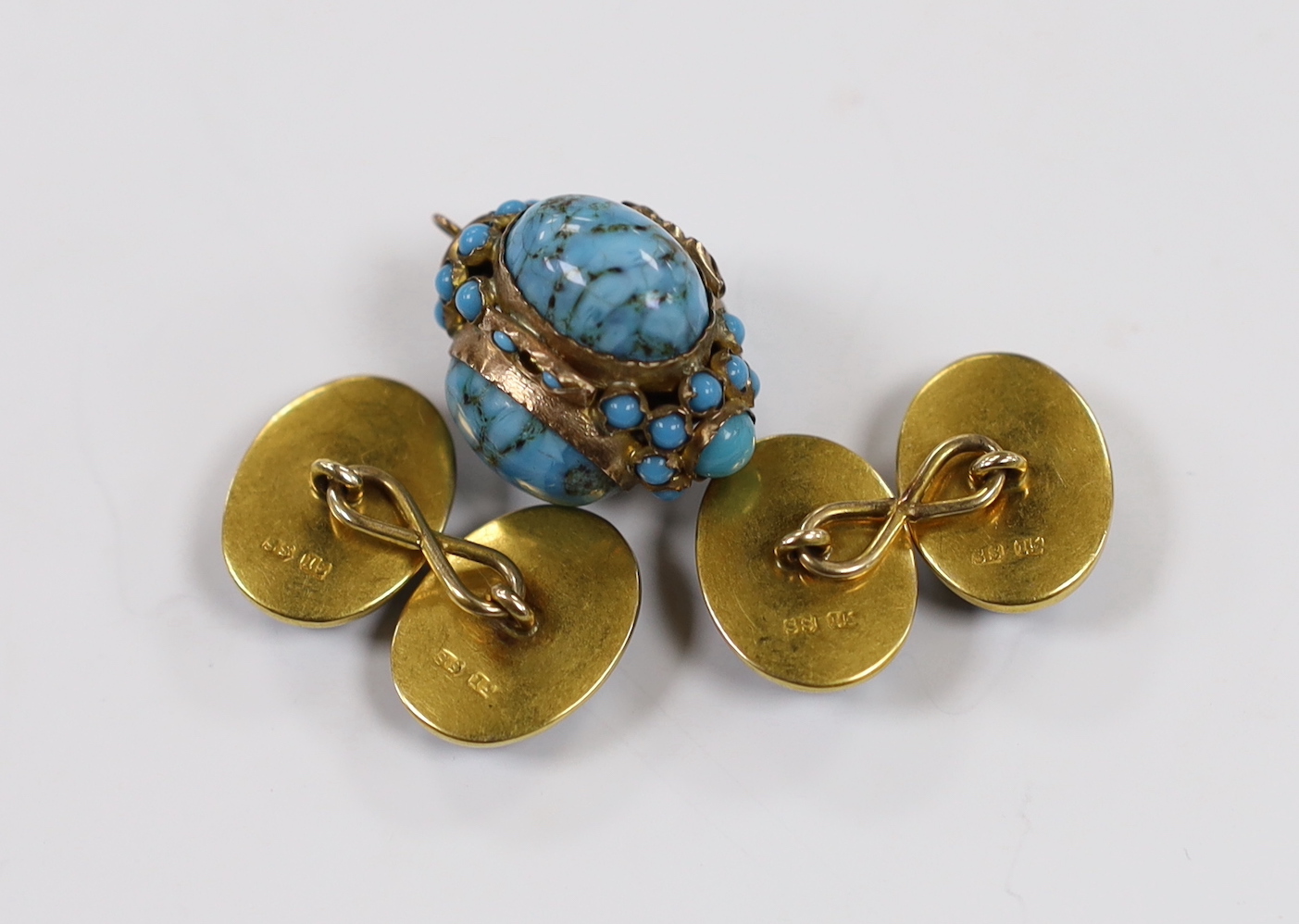 A pair of early 20th century yellow metal (stamped 15) and oval banded agate cufflinks and a yellow metal and turquoise cluster set pendant.